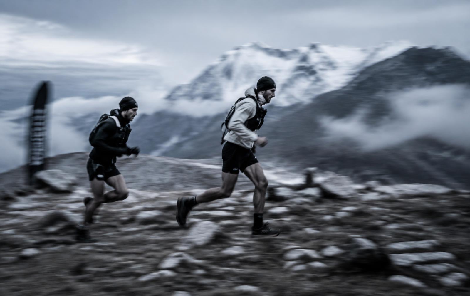 Trail runners on a high alpine ridge during a skyrace